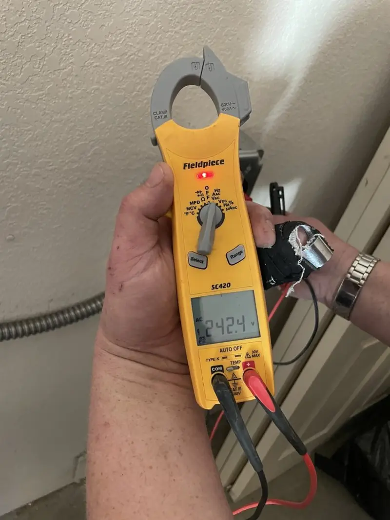 Voltage testing with clamp meter during Generator Installation in Mountain Lakes